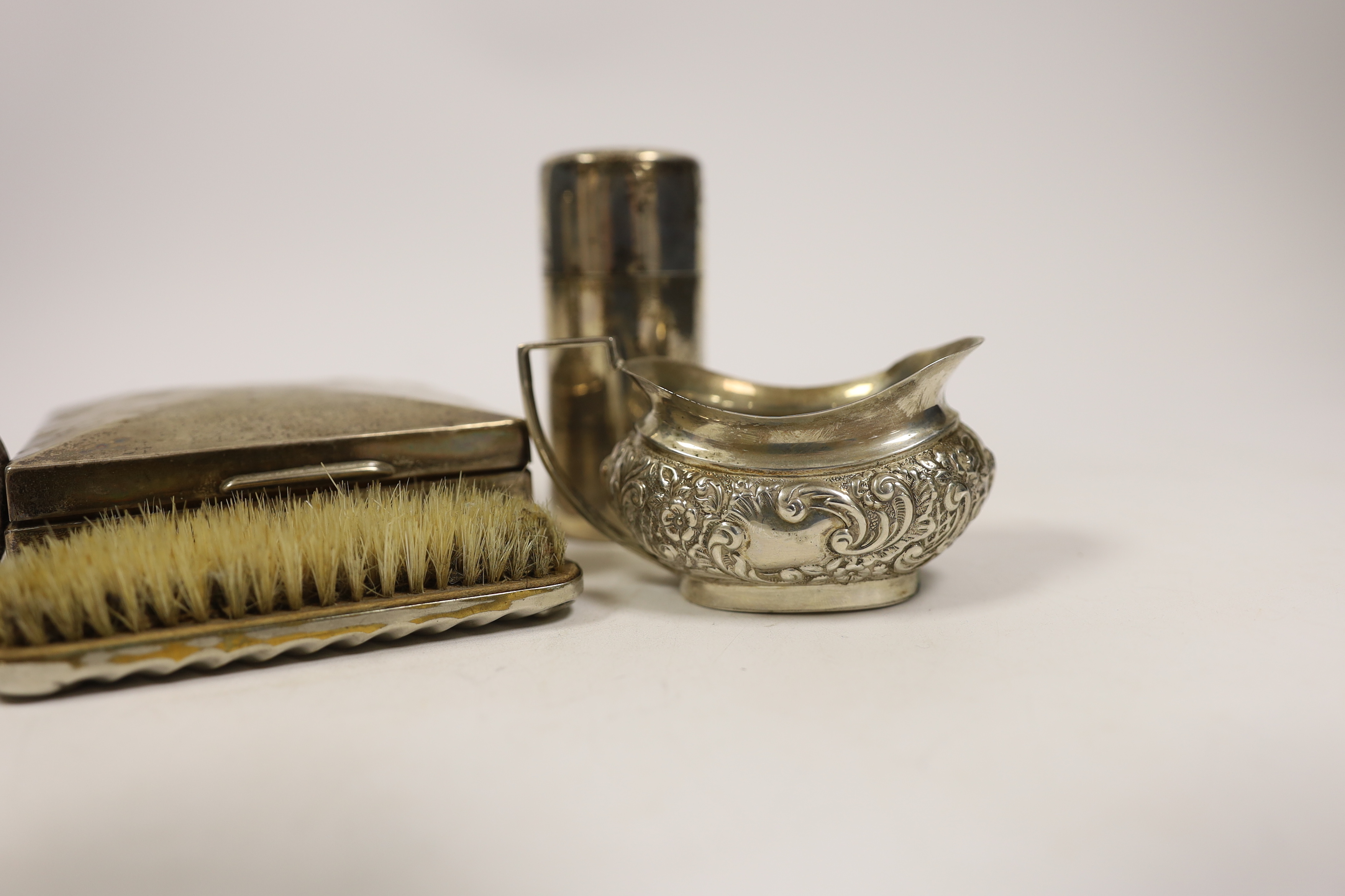 A late Victorian embossed silver cream jug, a pair of silver toilet bottles, a silver backed - Bild 3 aus 4