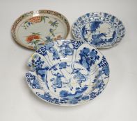 A Chinese blue and white ‘warriors’ bowl, Kangxi mark and period, a similar ‘hunting’ saucer dish,
