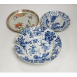 A Chinese blue and white ‘warriors’ bowl, Kangxi mark and period, a similar ‘hunting’ saucer dish,