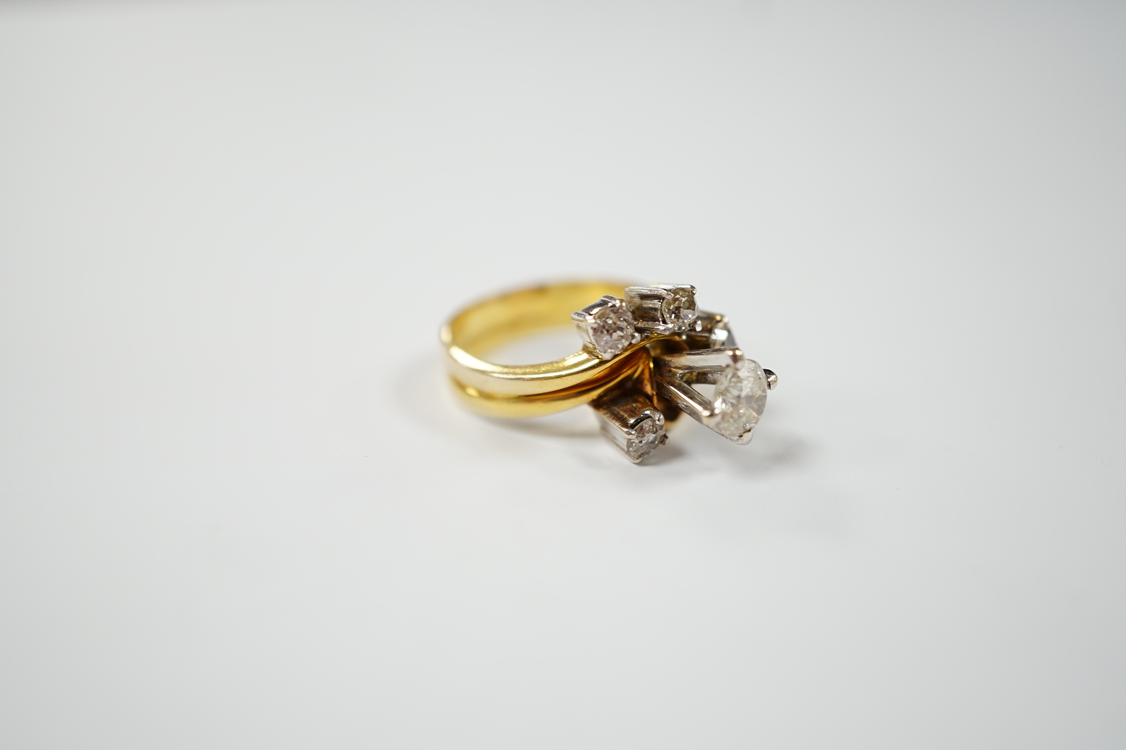 A yellow metal and graduated five stone diamond cluster set dress ring, in a raised setting, size - Image 3 of 4