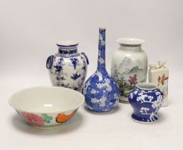 A collection of Chinese and Japanese ceramics, including a blue and white prunus flower baluster
