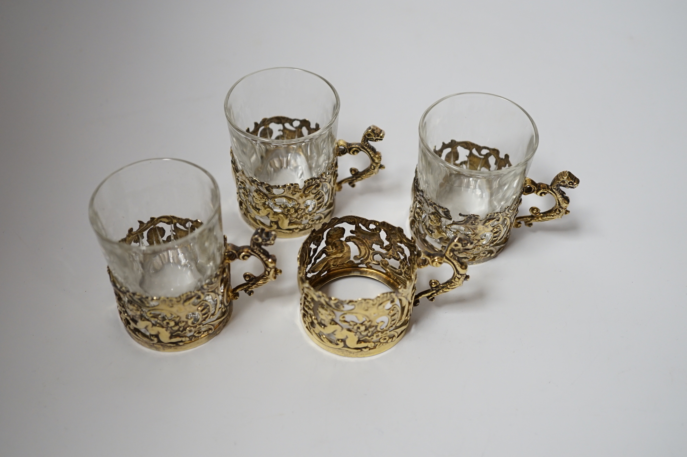 A set of four late Victorian pierced silver gilt coffee can holders, by William Comyns, - Image 3 of 3