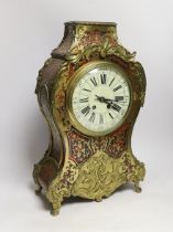 A 19th century Louis XV style red boulle eight day mantel clock