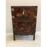 A Chinese lacquered two section cabinet on stand, width 84cm, depth 51cm, height 128cm