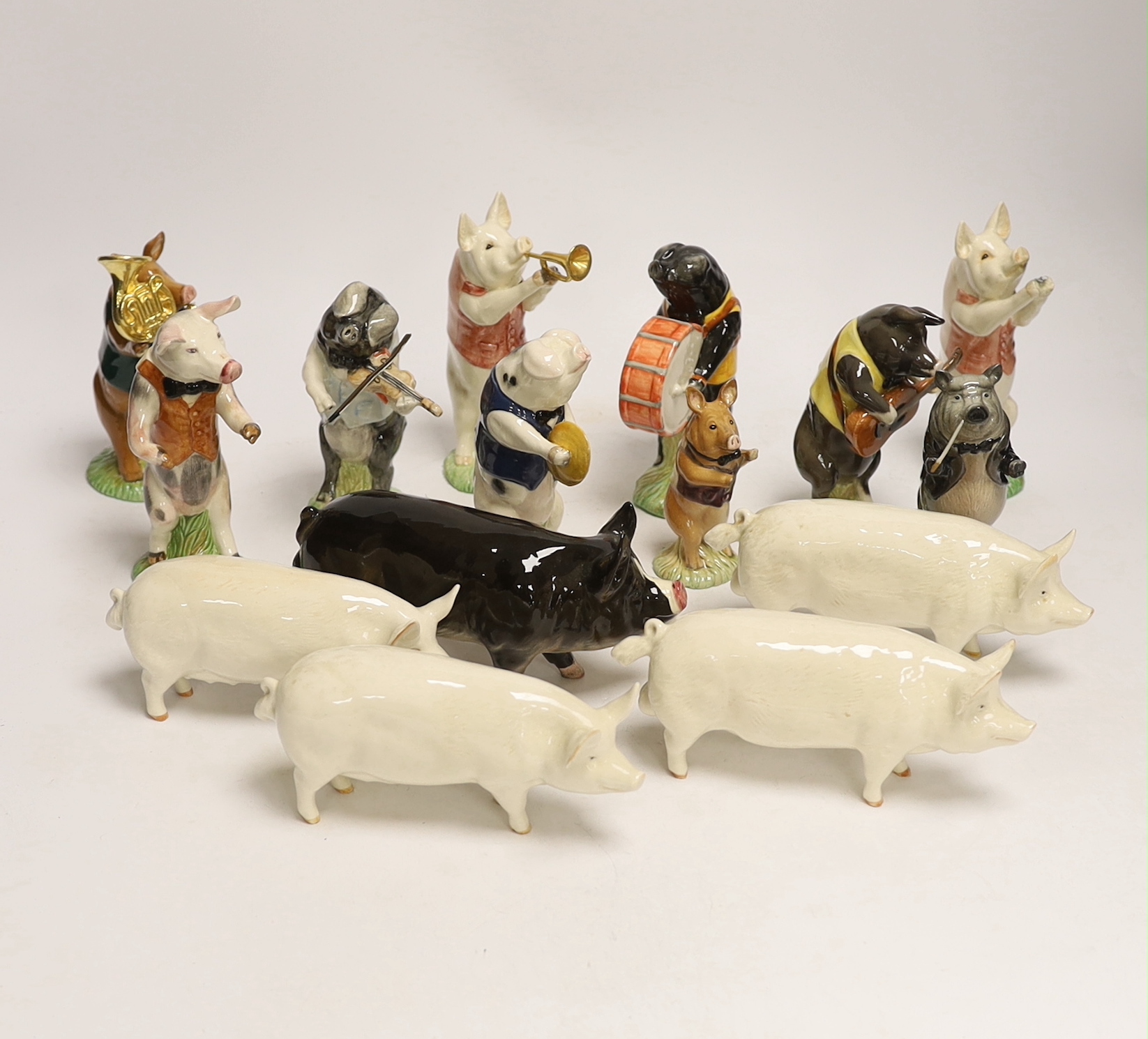 Five Beswick pigs and ten Beswick pig musician band figures