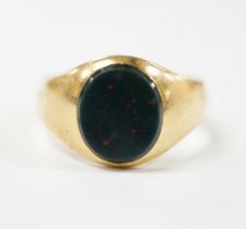 An 18ct gold and single stone oval bloodstone set signet ring, size Z+++++, gross weight 9.7 grams.