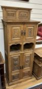 A late Victorian carved oak side cabinet, altered, width 68cm, depth 41cm, height 174cm