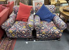 A pair of early 20th century club armchairs, Kilim style upholstered, width 90cm, depth 98cm, height