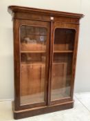 A Victorian mahogany two door bookcase, width 120cm, depth 37cm, height 165cm