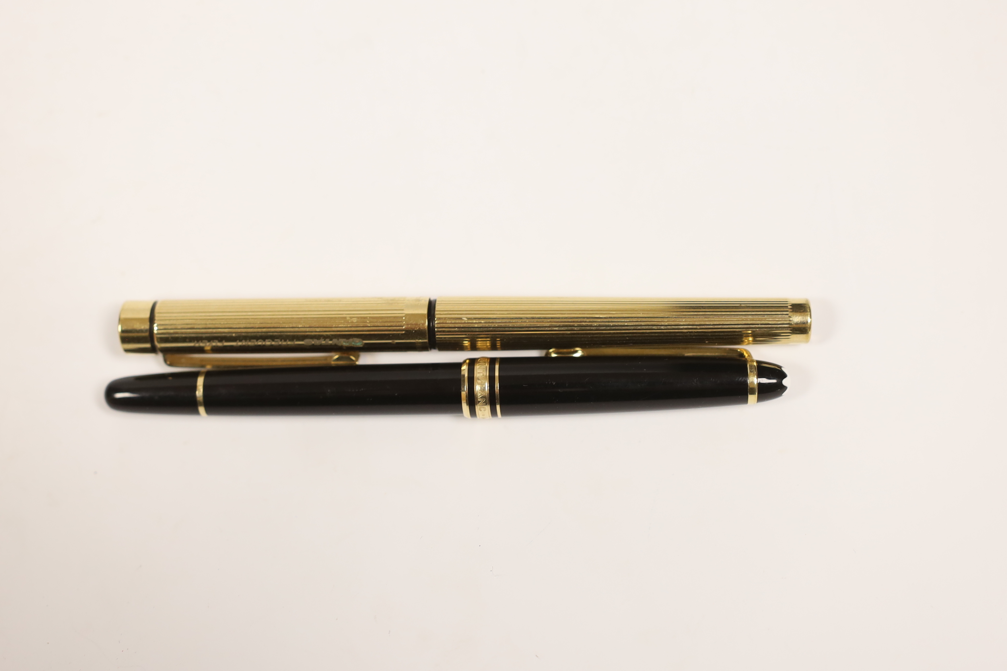 A Montblanc fountain pen and a promotional Qantas ‘Frequent Flyer’ pen