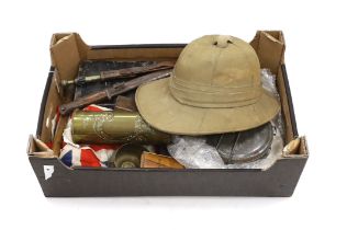 A collection of militaria including; a pith helmet, a T.G. Co. Ltd. Mk.III compass, a cased
