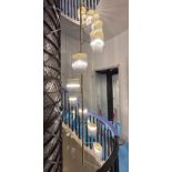 A contemporary stairwell chandelier by Baroncelli
