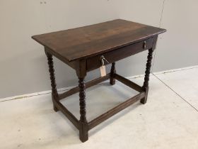 A 17th century Cromwellian rectangular oak single drawer bobbin leg side table, width 91cm, depth