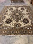 A machined Persian style ivory ground carpet, 330cm x 250cm