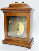 A walnut cased mantel timepiece with silvered dial, 37.5cm high