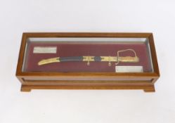A cased Spanish miniature presentation sword, dated 1961