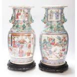 A pair 19th century Chinese famille rose ‘warriors’ baluster vases and stands, 39cm high including