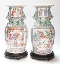 A pair 19th century Chinese famille rose ‘warriors’ baluster vases and stands, 39cm high including