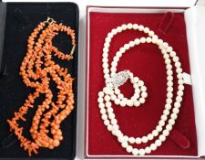 Two coral necklaces, one with beads the other branches, 33cm and a double strand cultured pearl