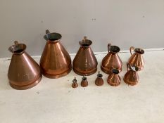 A matched graduated set of ten late 19th / early 20th century copper haystack measures, four gallons