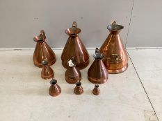 A matched graduated set of nine late 19th / early 20th century copper haystack measures, five