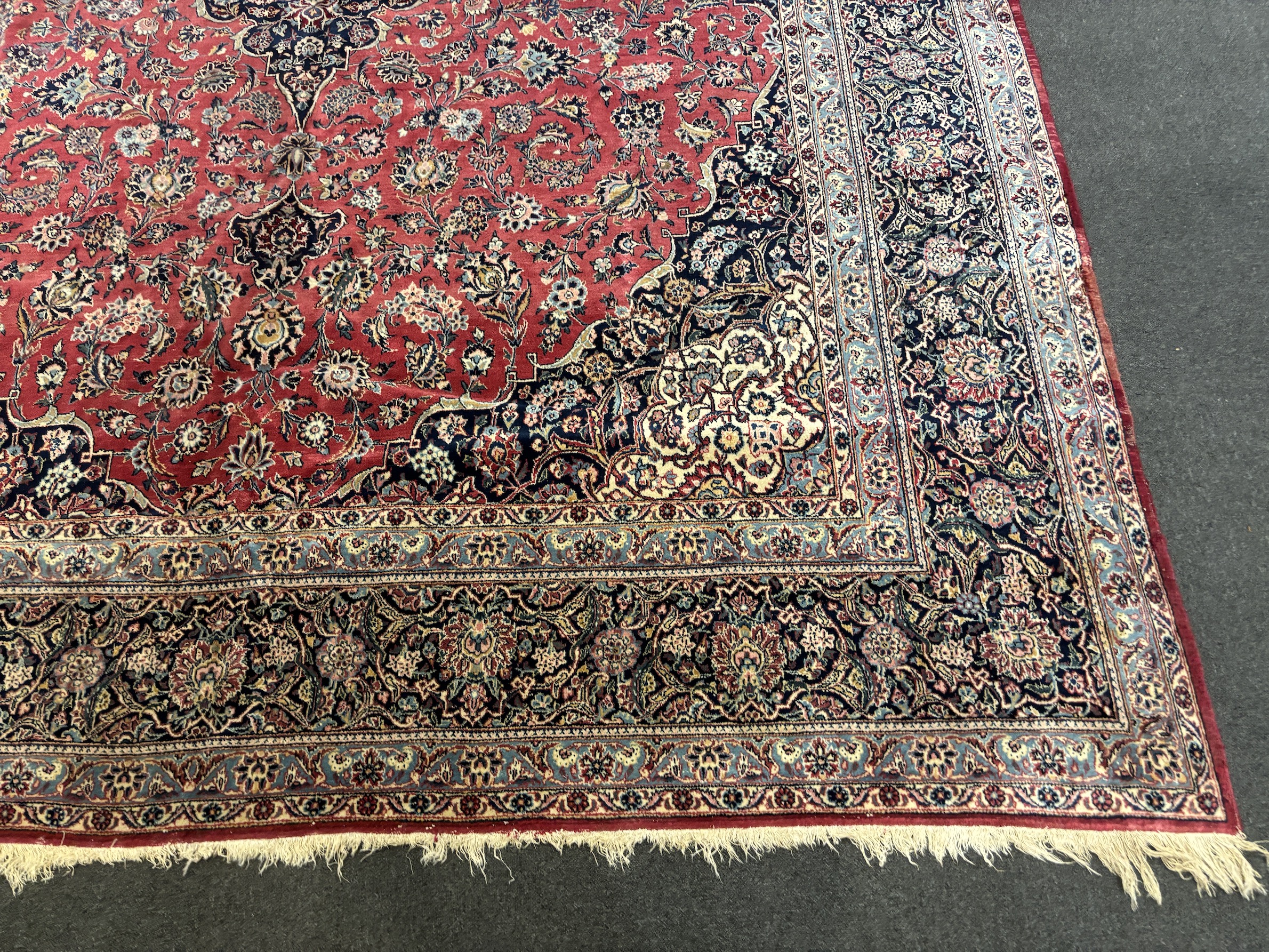 A Persian Kashan carpet with central medallion on a foliate red ground, multi bordered, 430 x 315cm - Image 3 of 5