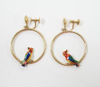 A pair of early 20th century 15ct loop ear clips, with a polychrome enamelled parrot perched upon
