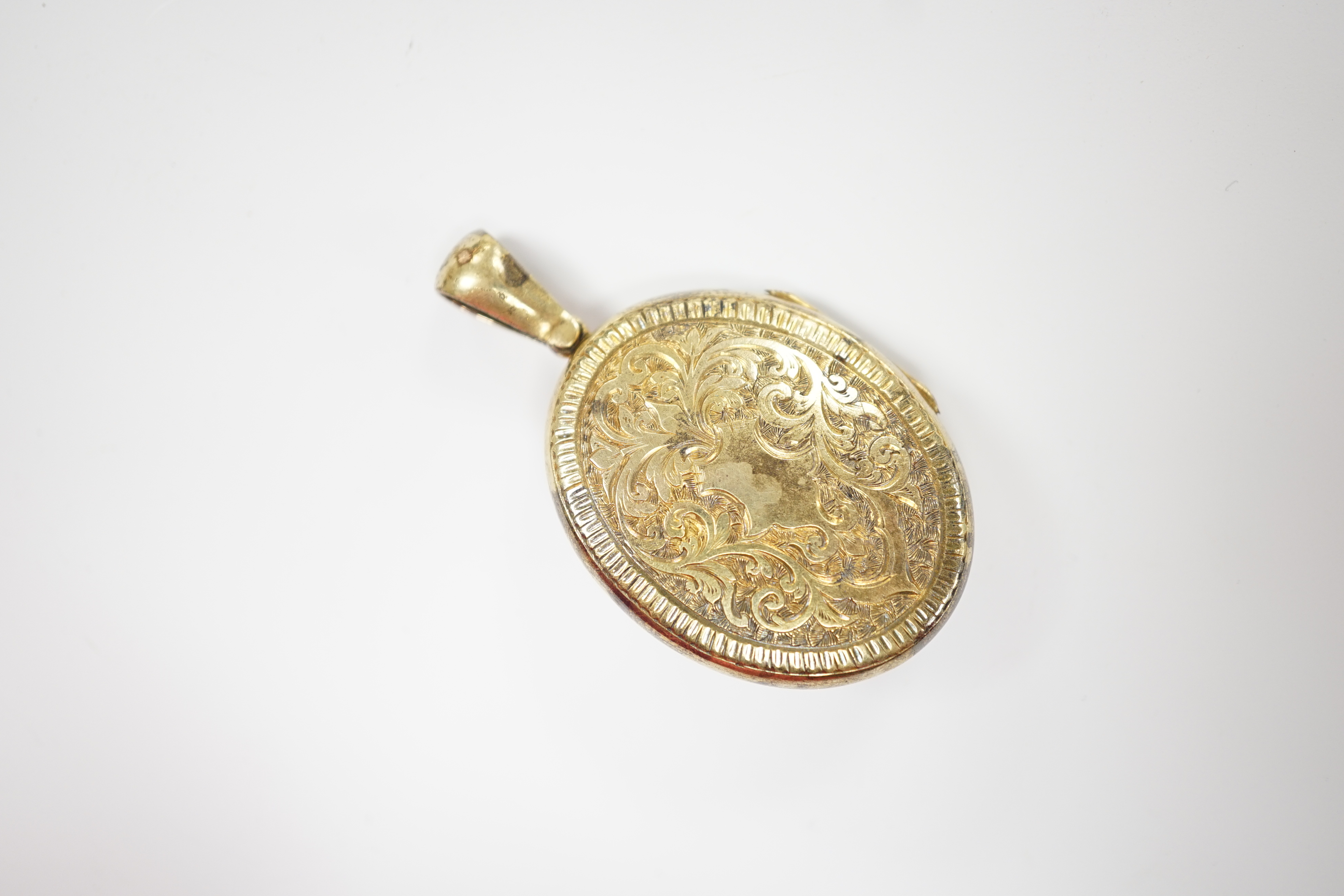 A late Victorian engraved yellow metal, seed pearl and gem set oval locket, overall 50mm, gross - Image 2 of 2