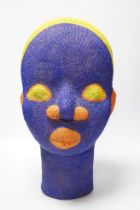 A large African clay multicoloured beadwork head, 48cm high