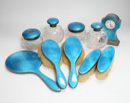 A George V silver and blue guilloche enamelled ten piece dressing table set, comprising four