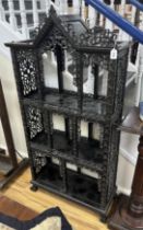 A Chinese carved hardwood open display cabinet, width 88cm, depth 35cm, height 179cm