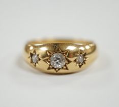 An Edwardian 18ct gold and gypsy set three stone diamond ring, size Q, gross weight 6.3 grams.