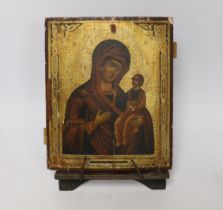 Late 19th century Russian School, hand painted Icon on panel, with stand, 26 x 21cm, unframed