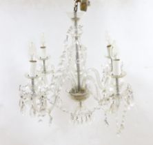 A glass four branch chandelier with hanging drops, 59cm high