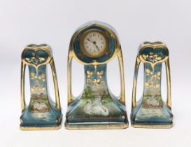 An Art Nouveau clock garniture, decorated with swans in a landscape, stamped ‘Made in England’ to
