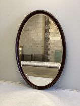 A large bespoke oval brass mounted mahogany mirror by Archer and Smith, width 118cm, height 179cm,