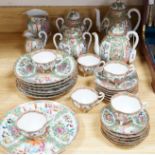 A Chinese famille rose six place setting tea service, including a large tea pot and cover, a smaller