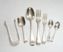 A small quantity of 19th century and later silver flatware, including three pairs of Georgian