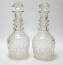 A pair of large Regency style cut glass magnum decanters and stoppers, 39cm high