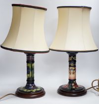 Two Moorcroft lamp bases, in Oberon and Violet patterns, 47cm high