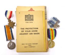 A First World War medal trio to Cpl. E.J. Hannaford, and a small collection of WWII publications
