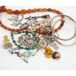 A small quantity of assorted jewellery, including an amber necklace, enamelled bird brooch etc.