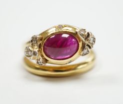 A modern Italian 750, synthetic cabochon ruby and diamond chip set coil shank dress ring, size J/