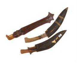 A large Finnish hunting knife, blade dated 1940 and burr wooden handle in its leather sheath, and