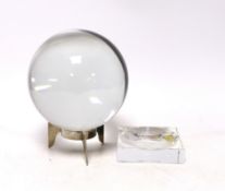 A large Baccarat glass crystal ball with two Baccarat stands, 16cm high