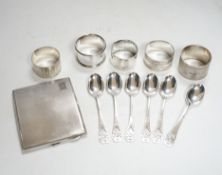 A concave engine turned cigarette case, 10.3cm, five assorted silver napkin rings and a set of six