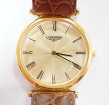 A gentleman's 24kt gold plated Longines quartz dress wrist watch, on associated leather strap.