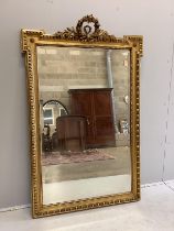 A 19th century French giltwood and composition wall mirror, with floral scroll pediment, width