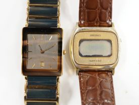 A gentleman's ceramic and gilt steel Rado Diastar wrist watch and a Seiko wrist watch.