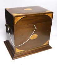 An Edwardian Sheraton revival inlaid mahogany portable drinks cabinet with tantalus and other